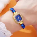 Detailed close-up of a luxury gold square watch with blue dial and gemstone strap - Blue