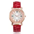Close-up detail of elegant rose gold quartz watch featuring a red crocodile pattern strap - Red