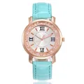 Close-up of elegant turquoise leather strap watch with sparkling rhinestone bezel detail - Light Blue