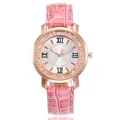 Detailed view of women's quartz watch with pink croc-patterned strap and rhinestones - Pink