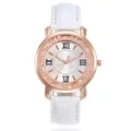 Detailed close-up view of a rose gold quartz watch featuring crystals and a white strap - White