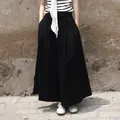 Veelzijdige zwarte culottes met wijde pijpen en hoge taille voor een slanke uitstraling. - S / Bottoms / Zwart
