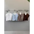 Blusa de manga corta con cuello en V para mujer en cuatro elegantes colores neutros - L / Tops / Marrón
