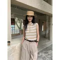 Women's beige striped crewneck sleeveless knit top in a lifestyle street setting - S / Tops / Khaki