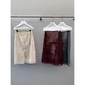 Eleganti gonne a trapezio in garza a vita alta nei toni crema, stampa bordeaux e grigio-blu - Taglia S / Pantaloni e gonne / Vista Posteriore