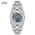 Luxury GEDI women's bangle watch encrusted with shimmering crystals and blue dial. - Bracelet / Silver Case Blue MOP Face Silver Bracelet
