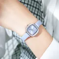 Elegant Gedi vintage small square women's watch with lavender leather strap on wrist - Light Blue Dial Gray-Blue Leather Strap / Silver