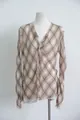 Detailed view of brown plaid sheer blouse with frayed V-neck and asymmetrical hem - S / Tops / Brown Plaid