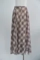 Close-up detail of the irregular hemline and flowy fabric on a brown plaid midi skirt - S / Bottoms / Brown Plaid