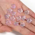 Iridescent purple five-petal flower beads for handmade DIY jewelry making on a palm - Translucent Purple Iridescent Five-Petal Flower