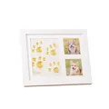Detail view of a white pet memorial frame with golden paw prints and cute dog photos - With Clay and Paint Kit / 28x23cm / White