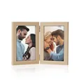 Detail view of a vintage folding wooden picture frame holding two 6-inch portraits - Vertical / Natural Wood Color