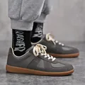 Premium retro grijze Duitse trainers met suède panelen en een rubberen zool - 38 / donkergrijs