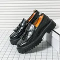Classic black chunky tassel loafers featuring embossed crocodile pattern leather - 38 / Tassel Style / Black