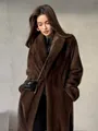 Detailed view of the luxurious long brown faux fur coat with soft texture - XS / Tops / Dark Brown