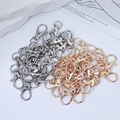 Detailed view of gold and silver alloy lobster claw clasps for DIY keychain crafts. - Lobster Clasps (250926-1) / 34mm / Gold