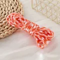 Detailed macro view of orange and white houndstooth 5mm polyester paracord for DIY - Orange White Houndstooth