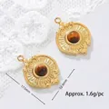 Macro detail of 18K gold plated sunray pendant with natural tiger eye stone and measurements - Rhombic Sunburst Disc