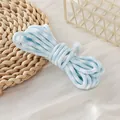 Macro view of the 5mm blue and white tie-dye braided polyester cord detail texture - Light Blue & White Houndstooth