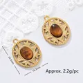 Detailed view of vintage tiger eye stone pendant with 20.5mm x 16.3mm dimensions and weight info - Hollow Carved Oval Style