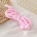 Detailed view of 5mm pink and white houndstooth patterned polyester DIY craft rope - 1 Meter (Trial Version) / Pink Houndstooth