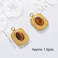 Close-up of 13.2x8.7mm tiger eye stone pendant in 18K gold plated stainless steel - Square Shape