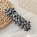 Detailed close-up view of 5mm black and white houndstooth pattern paracord for DIY crafts - Black and White Houndstooth