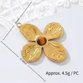 Detail of tiger eye stone inlay and textured petals on a gold-plated flower pendant. - Four-leaf Flower 2