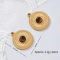 Macro shot of 18K gold-plated titanium steel tiger eye pendant with dimension labels - Sun Totem Coin