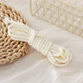 Macro detail of white 5mm braided polyester cord for DIY crafts and accessories - Rice White Houndstooth