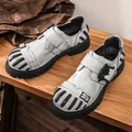 White leather low-top work shoes for men featuring a gothic skull buckle detail. - 38 / Gray (99308)