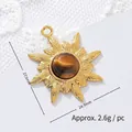 Close-up of a sun-shaped 18K gold-plated titanium steel pendant with tiger eye stone - Sunflower 2