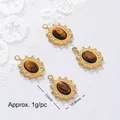 Detailed view of gold-plated tiger's eye pendants with 15mm and 10.8mm measurements. - Sun Pattern Oval Style