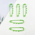 Close-up of bright green safety pins with triple loops for DIY jewelry and bag charms - Lacquered Large Pin / 5 Pieces / Green