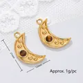 Detailed macro view of crescent moon pendant with tiger eye stone, 21mm x 12mm size - Moon