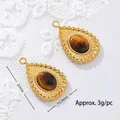Detailed view of an 18K gold plated stainless steel tiger eye pendant with size measurements - Beaded Edge Teardrop