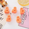 Close-up of orange acrylic ampersand beads for DIY jewelry making and crafts - & Symbol (6mm Hole) / Orange