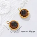 Macro view of tiger eye stone pendant showing 11mm diameter and 0.8g weight per piece - Beaded Round Style