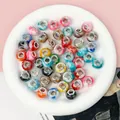 Close-up of vibrant marbled 5mm large hole acrylic abacus beads for DIY jewelry crafts - Chinese Style Color Mix