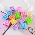 Macro view of colorful acrylic cube beads with embossed star pattern for DIY jewelry making - Star Cube Bead / 20x20mm (8mm Hole) / Multicolor