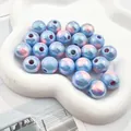 Close-up of 3mm holographic blue and pink acrylic beads for DIY jewelry making. - Blue