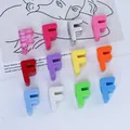 Close-up detail of colorful 6mm acrylic letter F beads for DIY keychain and phone chain making. - Letter F / 6mm Aperture / Purple