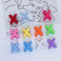 Detail view of colorful 6mm acrylic X-shaped alphabet beads for DIY jewelry - Letter X / 6mm Aperture / Purple