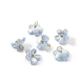 Detailed view of iridescent light blue flower charms with gold centers and hanging loops - Iridescent Cherry Blossom (11*11.5mm) / 10 Pieces Pack / Blue (4656)