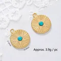 Close-up of 18K gold plated stainless steel star pendant with turquoise bead - Gold Star Coin
