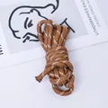 Close-up of a 5mm brown and white woven paracord for DIY bag straps and keychains - Trial Style / 1 Meter / Dark Brown