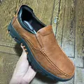Men's brown leather loafers with textured finish and slip-on design. - 40 / Orange