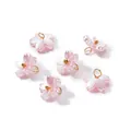 Close-up of pink pearlescent Sakura flower charms with gold loops for DIY jewelry - Pink (4656)