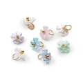 Close-up of pearlescent ABS flower charms with hanging rings for DIY jewelry making - Iridescent Random Mix (4657#)