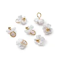 Close-up of ABS pearl flower charms with iridescent finish and gold loop hangers - Iridescent White (4657#)